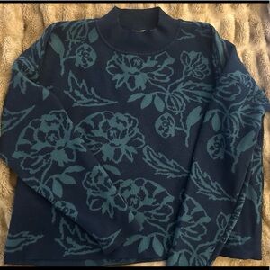 Cyrus brand mock neck sweater with floral print